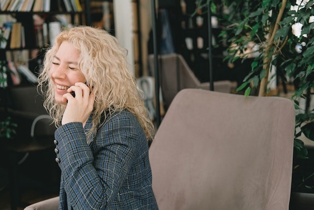 woman talking happily on the phone